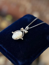 Load image into Gallery viewer, Vintage Sterling Silver Black Onyx and Mother of Pearl Double Sided Spinner Bow Motif Pendant Necklace 18”