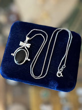 Load image into Gallery viewer, Vintage Sterling Silver Black Onyx and Mother of Pearl Double Sided Spinner Bow Motif Pendant Necklace 18”