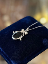 Load image into Gallery viewer, Vintage Sterling Silver Black Onyx and Mother of Pearl Double Sided Spinner Bow Motif Pendant Necklace 18”