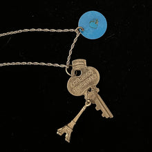 Load image into Gallery viewer, “KEY TO THE CITY” Handmade Charm Cluster Necklace Vintage American Tourister Key Advertising Tag & Eiffel Tower Charm
