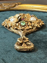 Load image into Gallery viewer, Vintage Midcentury Signed FLORENZA Gold Tone Floral Vanity Mirror Embellished with Green &amp; Pink Rhinestones and Faux Pearls
