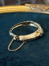 Load image into Gallery viewer, Vintage Midcentury Textured Gold Tone Wave Motif Hinged Bangle Bracelet Unsigned
