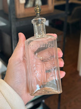 Load image into Gallery viewer, Antique 1910s Edwardian Clear Glass Holy Water Bottle Cross &amp; Leaves with Metal Crown Cap 6” Tall
