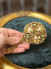 Load image into Gallery viewer, Vintage Midcentury Signed FLORENZA Gold Tone Floral Vanity Mirror Embellished with Green &amp; Pink Rhinestones and Faux Pearls

