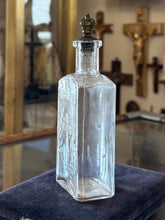 Load image into Gallery viewer, Antique 1910s Edwardian Clear Glass Holy Water Bottle Cross &amp; Leaves with Metal Crown Cap 6” Tall
