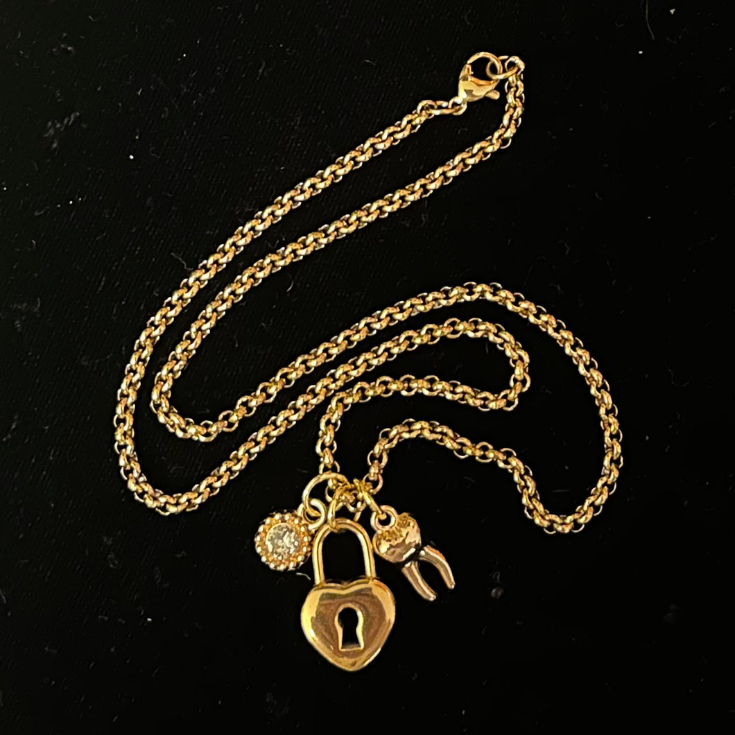 ‘NOT TELLING’ Lock & Tooth Charm Necklace