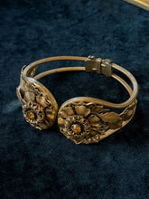 Load image into Gallery viewer, Vintage 1940s Brass Tone Floral Clamper Bracelet Faceted Amber Rhinestones
